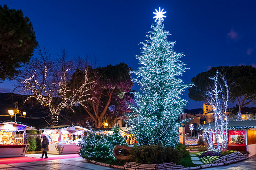 People at the Christmas market on the lakeside of Garda, a town on the eastern shore of Lake Garda, in the Province of Verona, northern Italy.