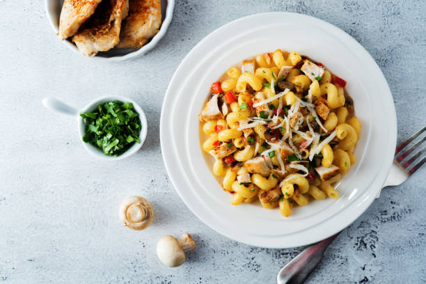 istock Roasted chicken mushroom pepper pasta in a white plate 1224756784