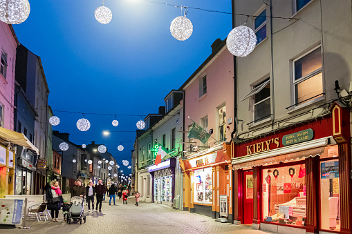 People strolling at Christmas in downtown Waterford, a city in the south east of Ireland.