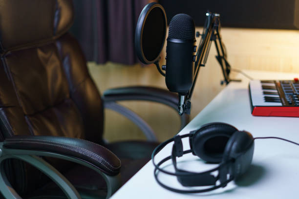 istock Condenser microphone, earphone and sound mixing console board. Equipment for the music studio. 1224760700