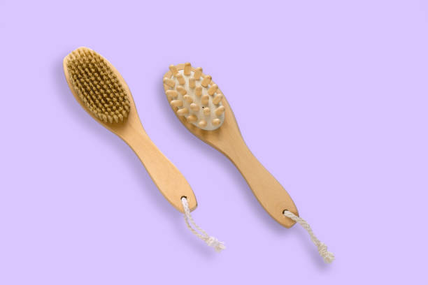 istock brush for dry skin massage on a pastel violet background 1224761721