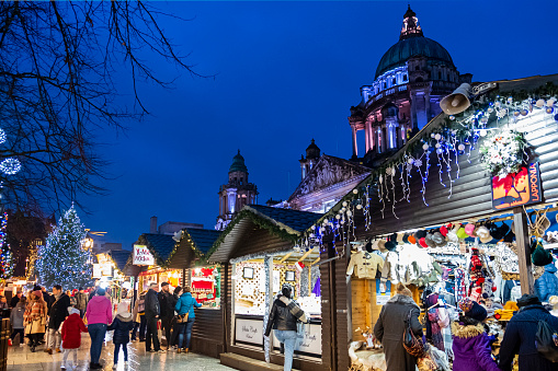 People at the Christmas market at the Belfast City Hall, in the downtown of the capital city of Northern Ireland.