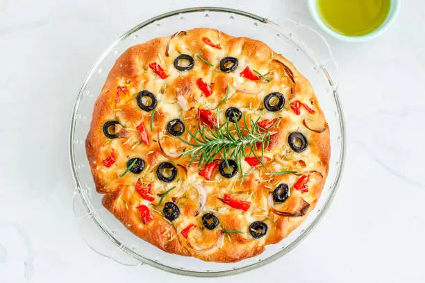 Italian Focaccia Bread Garnished with Rosemary Leaves, Directly Above Photo