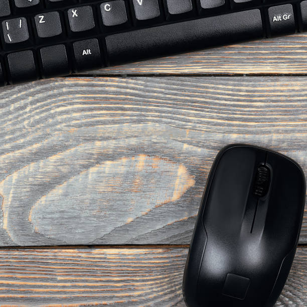 istock Workplace smart watch, keyboard, mouse on a wooden table. 1224765004