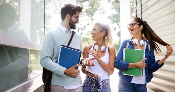 istock Group of happy students studying, preparing together for exam ourdoor 1224765318