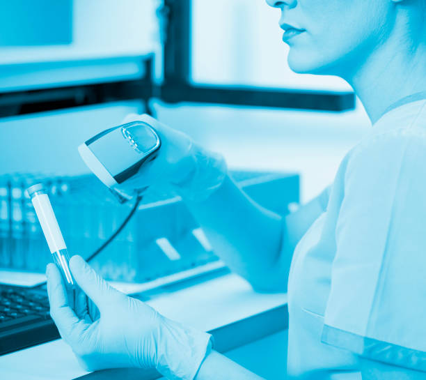 istock Doctor in Medical laboratory working test with medical samples  using modern equipment. Laboratory Medical Equipment Medical devices for analyzes. Tested for Coronavirus (COVID-19),  AIDS and definition of DNA, RNA virus. 1224768283