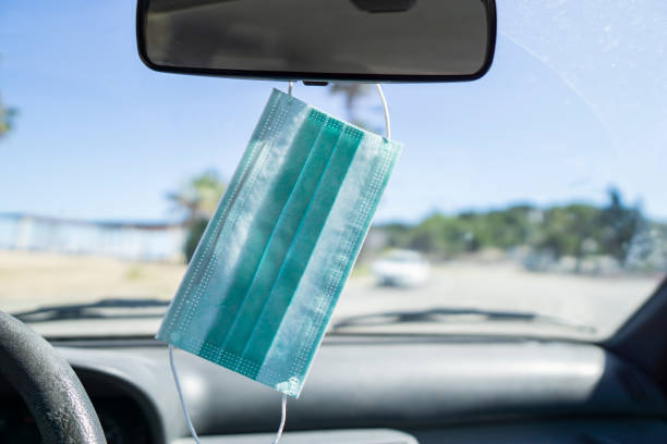 istock Sanitary mask inside the car for the new normal 1224768665