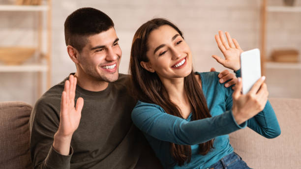 istock Happy couple making video call on phone at quarantine 1224769579