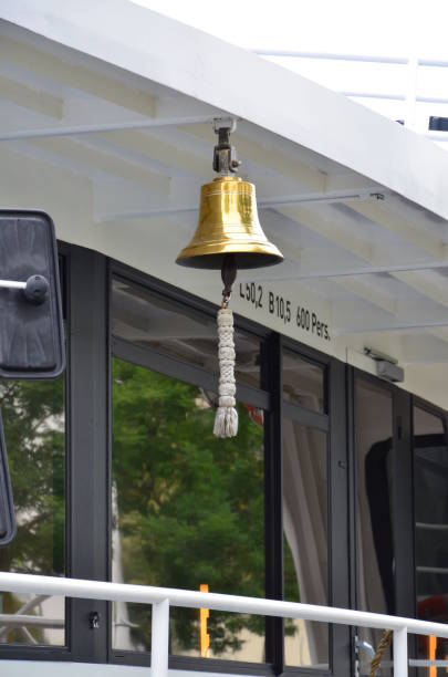 Antique brass ship's bell with a rope