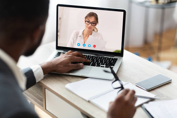 istock Boss having discussion during video call with colleague 1224770056