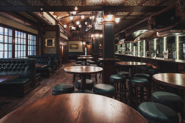 Empty Restaurant Interior Interior of wooden retro restaurant with empty chairs, tables and other furniture, without people pub bar stock pictures, royalty-free photos & images