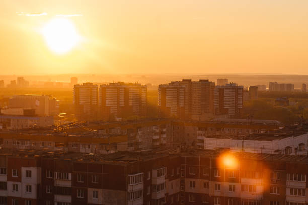 Sunset over the russian city. Orange color, gradient. Tonal perspective.