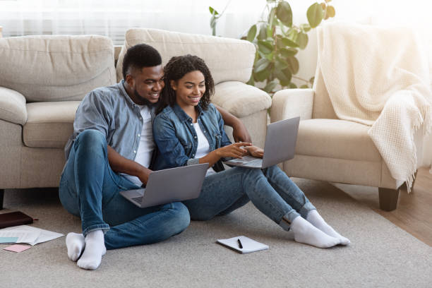 istock Remote Work. Black Couple Using Laptops At Home, Working Online Together 1224772855