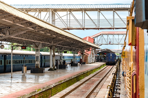 Very common scene of a Clean Indian Railways platform. The weather is calm and serene and this railway platform is less crowded with daily commuters who are not recognizable, and are waiting for their daily local to make a journey to their work and to their loved ones. Indian Railways is among the most complicated railway networks all over the globe.