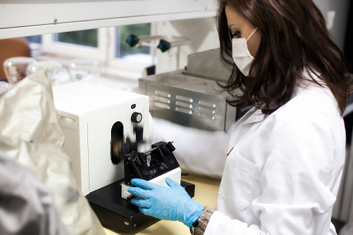 female researcher is workin in lab