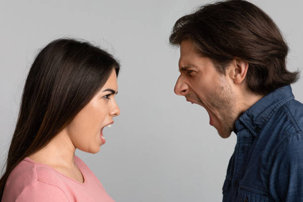 istock Relationship Crisis. Angry Couple Screaming At Each Other Over Light Background 1224774642