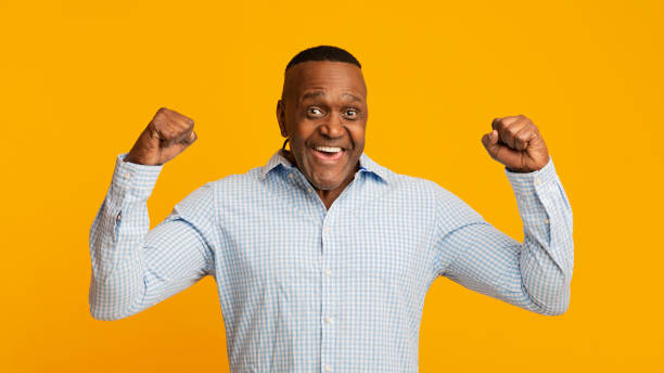 istock Strong middle aged african american man showing biceps 1224774653
