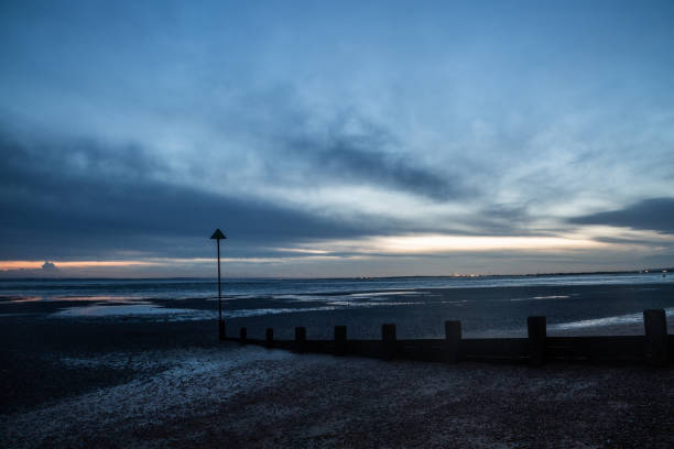 istock Beach with groyne at dusk 1224774905