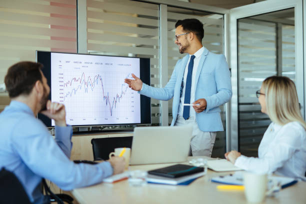 istock Young male executive leading presentation in meeting room 1224776007