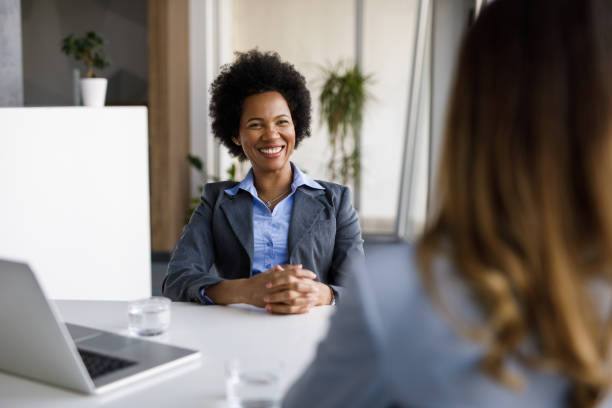istock Two diverse businesswomen talking, working together in office 1224777544