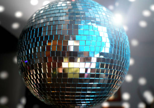 istock Mirror ball at a party with light spot reflections 1224777566