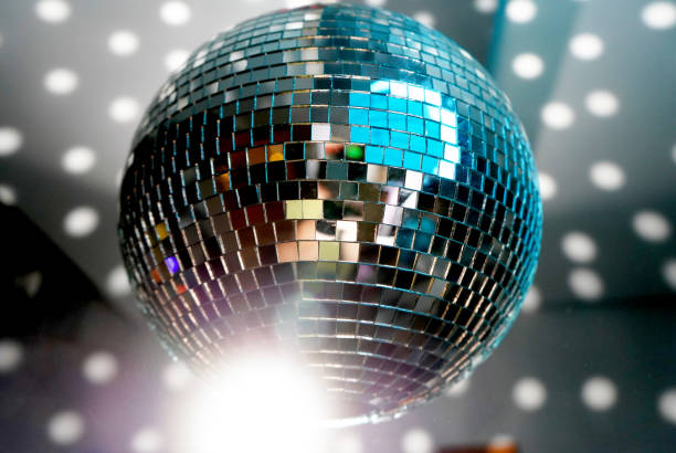 istock Mirror ball at a party with light spot reflections 1224777594