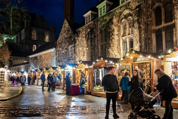 People strolling at the Christmas market set up at the Winchester Cathedral.