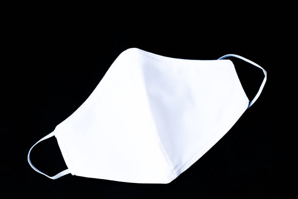 istock Cloth white mask isolated on black background - for prevent dust (PM 2.5), 