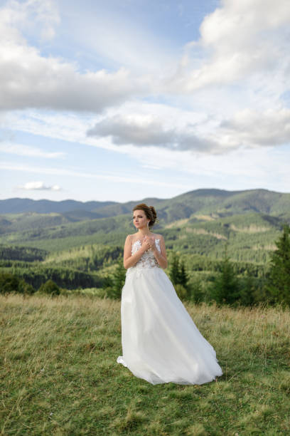 istock The bride herself poses on a background of mountains. 1224779172