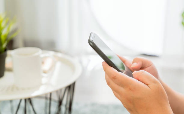 istock Hand using smartphone, During leisure time. The concept of using the phone is essential in everyday life. 1224779422