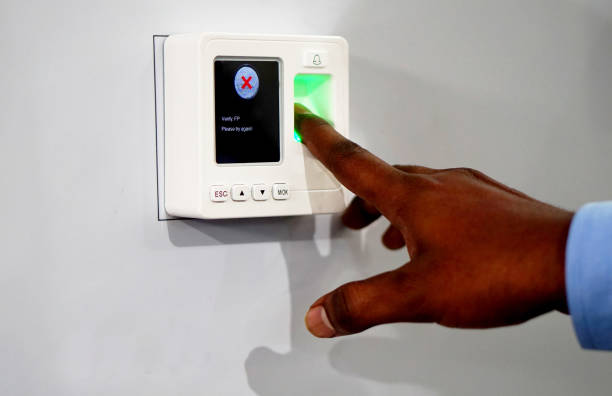 istock View of man touching finger print reader attendance and accessibility equipment 1224781655