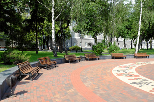 istock Benches stand in a semicircle in a city park. 1224781893