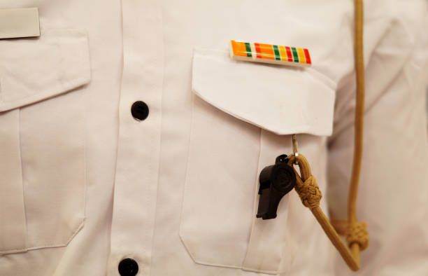 Close-up of whistle on Indian uniformed policeman