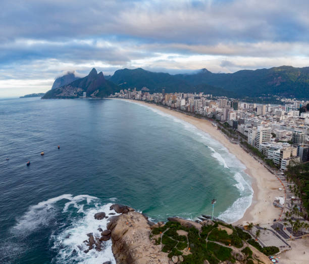istock Swirling wave pattern at Arpoador rock in Rio de Janeiro, Brazil, with Ipanema beach and wider cityscape in the background 1224782831
