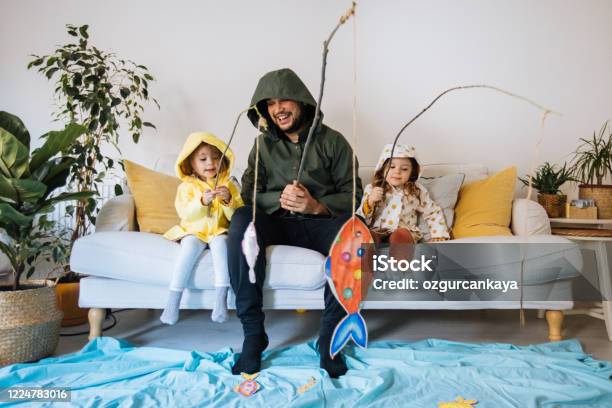 Kids With Father Playing Fishing At Home Stock Photo - Download Image Now - Family, Child, Playing