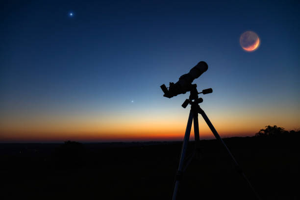 istock Silhouette of a astronomy telescope with twilight sky. 1224783729