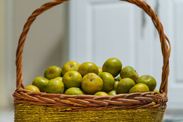 A pile of tangerine orange in a fruit basket