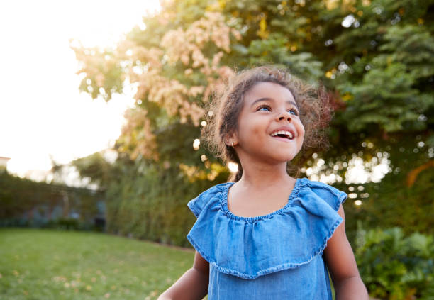 istock Young Hispanic Girl Having Fun Playing Outdoors In Garden 1224786849