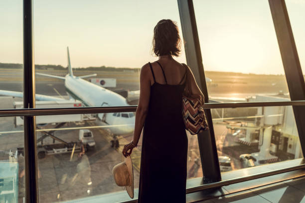 istock Beautiful young female on airport 1224790023