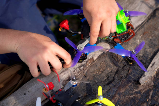 istock man repairs and adjusts a racing drone 1224792192
