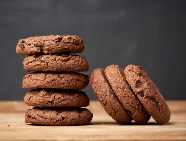 istock stack of baked round chocolate chip cookies on a brown wooden table 1224793589