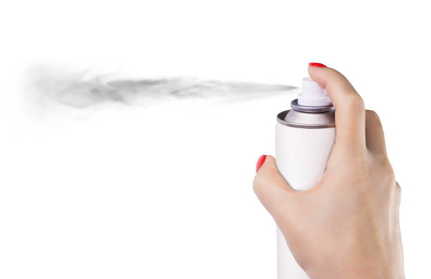 istock Woman spraying paint from can on white background 1224793619
