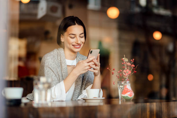 istock Beautiful young woman relaxing in a cafe 1224794769