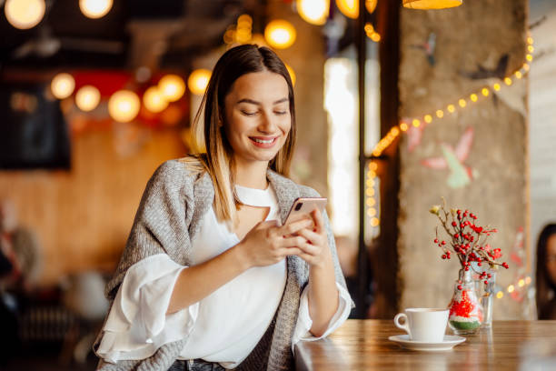 istock Beautiful young woman relaxing in a cafe 1224794787