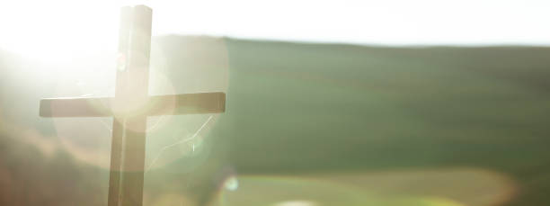 istock cross in nature at the sunset 1224794898