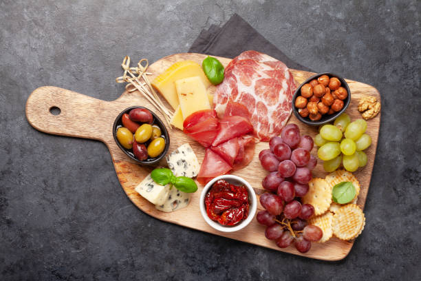 istock Cheese, meat, grapes and olives antipasto 1224796110
