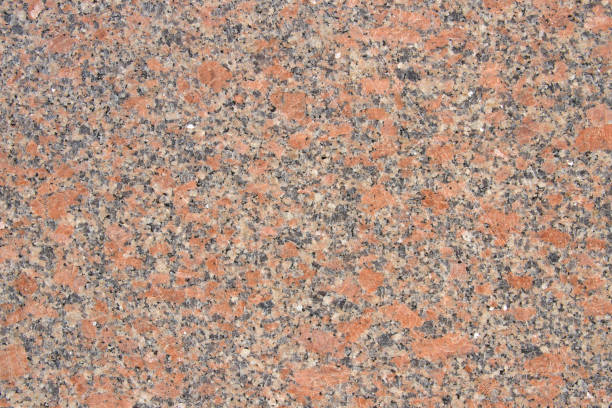 istock Polished bright red granite texture with natural pattern. Background of natural stone. 1224796555