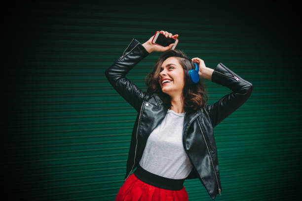 istock Young girl dancing to the music 1224799751