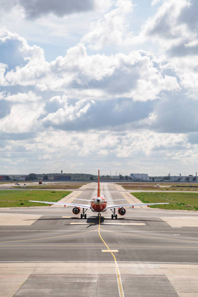 istock Plane after landing directed to airport building 1224800868