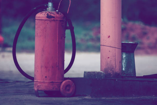 istock Vintage red Gas containers. Cooking gas cylinders on refill 1224802359